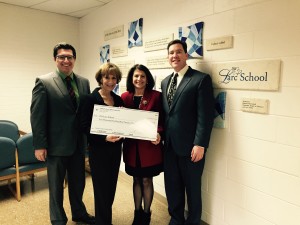 Mr. Dennin, Foundation President Brenda Eutsler, and Matt Rooney handing a $10,000.00 check to the LARC School Executive Director Susan Weiner.